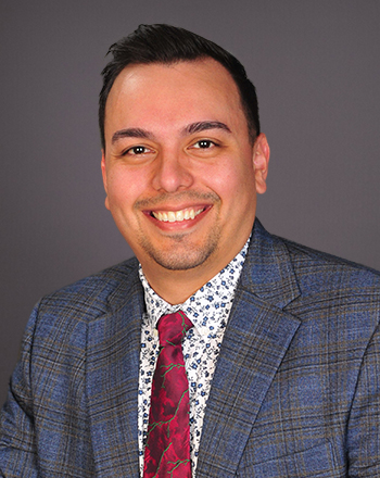 Headshot of Claros Dennis