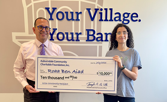 Joe DeVito and scholarship winner Anika Thomas of Newton South holding a big check